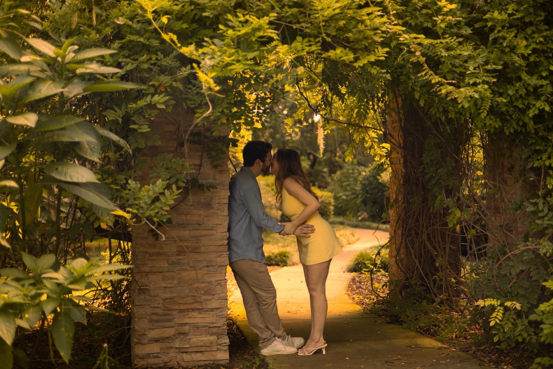 Amber and Joey beneath the garden arch